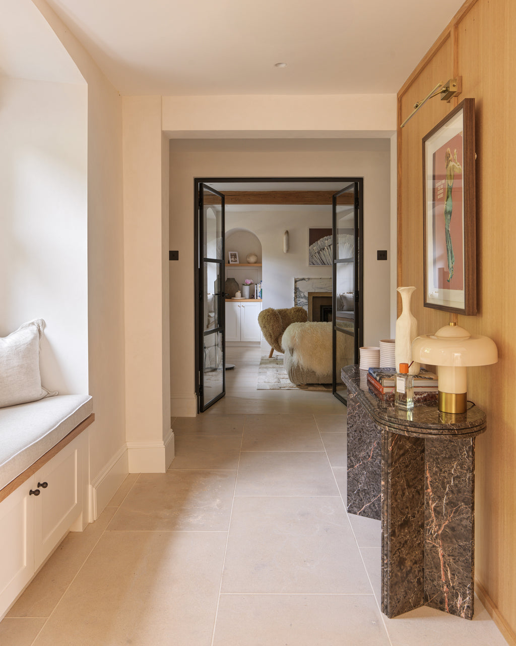Buscot Limestone Etched Finish floor tiles in an entrance hall looking through black Crittall doors into a sitting room