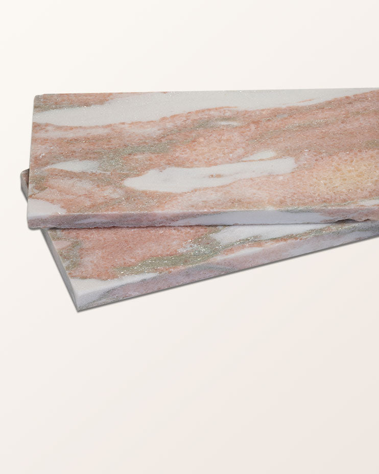 East Java Flamingo Marble Honed Brick shown as two bricks resting at an angle, showing the honed face and the thickness of the cut edge