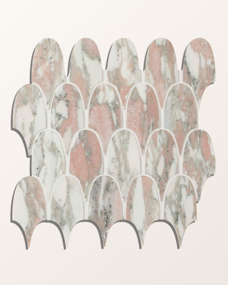 A full sheet of East Java Flamingo Marble Plume Mosaic shown flat against a plain cream background, the feather-shaped pieces running pink, white and grey-veined