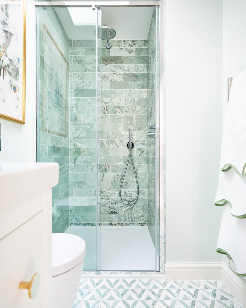 East Java Hummingbird Marble Honed Brick lining a narrow shower enclosure in a white ensuite, with an East Java Hummingbird Marble Temple Mosaic floor running up to the tray