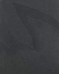 Close-up of the Metropolitan Slate Riven Slab surface, showing the charcoal tone and the cleft ridges and pale seams of the riven finish