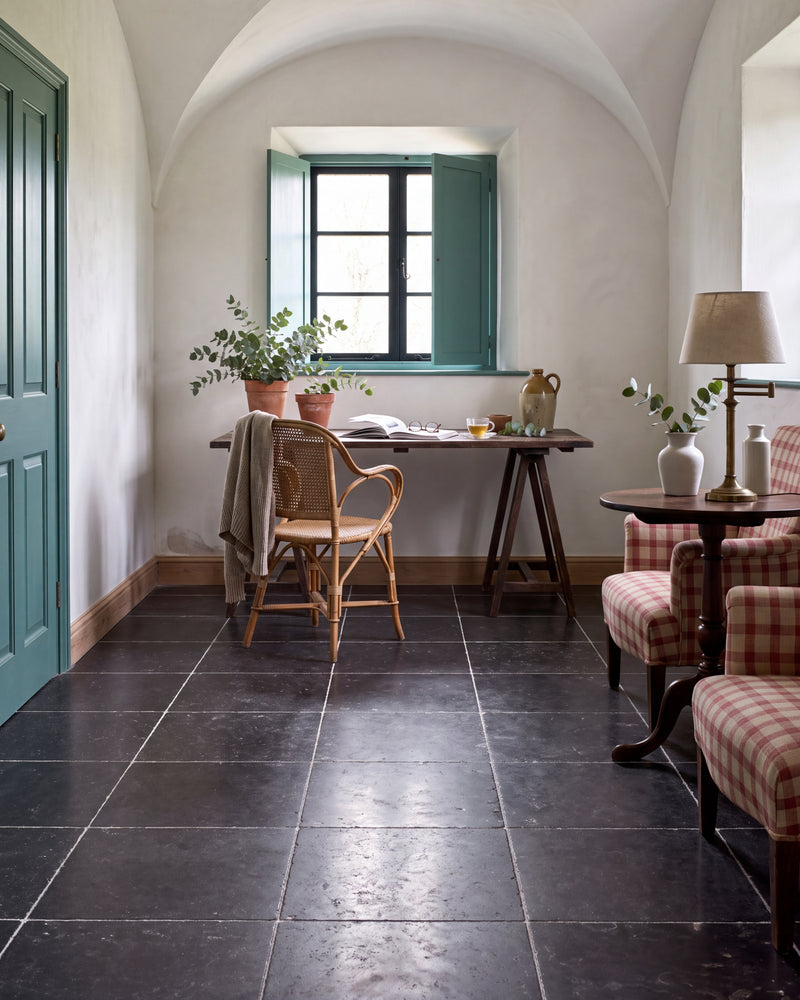 Royal Mink Limestone Tumbled Finish laid square across a vaulted plaster room with teal shutters, a trestle desk and checked armchairs